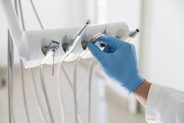 Professional Tooth Extraction technician working in Harrison County County, IN